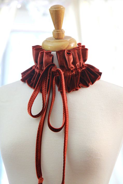 "Complete a holiday party ensemble with a Victorian style fashion collar, featuring a beautiful and soft velvet, available in a rainbow of colors!! Drawstring ties make it easy to create your own look with it on a whim. Wear it 4 different ways: *As a choker with ties in front. *As a choker with ties to the side. *As a choker with ties to the back. *As a statement necklace. -90% polyester; 10% spandex velvet. -One size fits most. -4.25\" in height. -Approximately 14.5\" in length (ruffles), with Kos, Couture, Neck Ruffle Collar Diy, Diy Collars For Women, Ruffle Collar Diy, Victorian Ruffle Collar, Victorian Style Fashion, Embroidered Choker, Collar Clothes