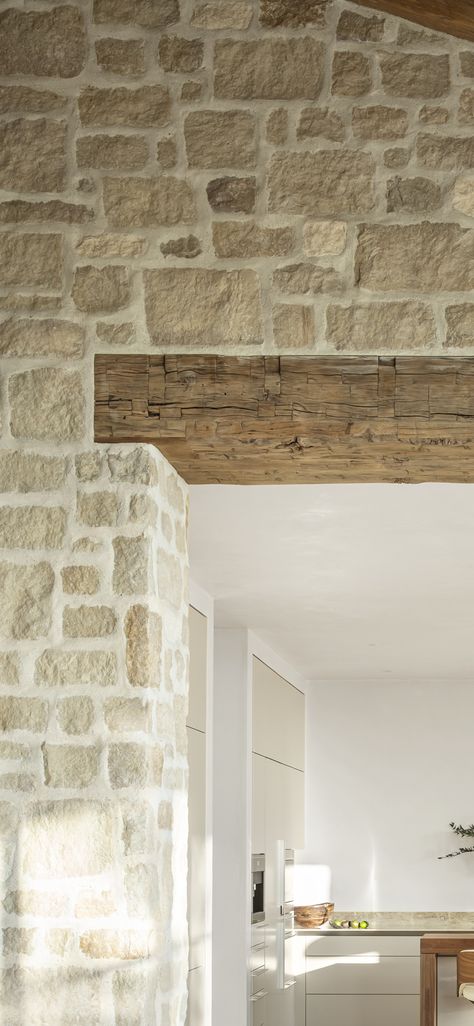 Lounge With Beams, Vaulted Ceiling Kitchen With Beams, Wood Beam Opening, Wood Beam Over Window, Wood Beam Header, Modern Stone Farmhouse, Faux Beams Bathroom, Diy Box Beams, Reclaimed Beam Mantle