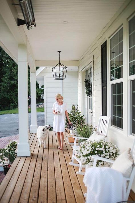 A favourite spot at our home is the front porch. It’s a beautiful place to sit in the morning and listen to the birds sing. In the evening,  the sun sets just right above and below the trees,  so Steve and I love to unwind from the day and watch the kids play up and down our long driveway. When… White Farmhouse With Front Porch, Long Verandah Ideas, Cottage Home Front Porch, Back Porch Inspiration Outdoor Living, Front Porch Ideas Large, Styling A Long Front Porch, Front Porch Bench Styling, Front Porch On White House, Traditional Porch Ideas