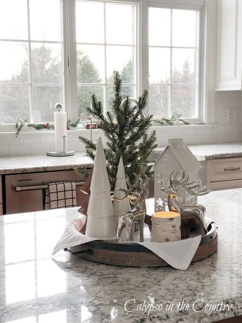 Kitchen Island Tray Decor (a Cozy Winter Theme) - Calypso in the Country Christmas Centerpieces Kitchen Table, Christmas Tree On Buffet Table, Christmas Center Island Decor, Xmas Island Decor, Christmas Tray Decor Kitchen, Christmas Wooden Tray Decor, Farmhouse Christmas Island Decor, Kitchen Island Christmas Decor Ideas Decorative Trays, Cute Christmas Kitchen Decor