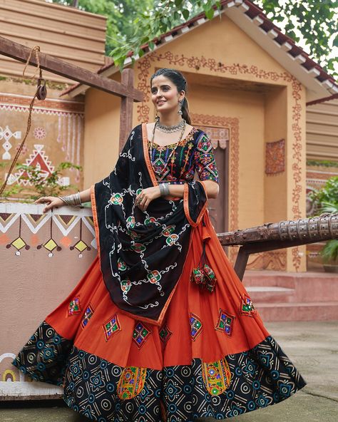 Moderate orange and black navratri lehenga with embroidery and mirror work with viscose rayon dupatta to draped in your style in this navratri festival ✨🧡 SHOP NOW 🛍️ gotifab.com [lehengacholi, navratri lehengas, navratri collection, garba outfits, navratri chaniya choli, lengha choli] #lehengacholi #navratrilehenga #navratricollection #chaniyacholis #garbaoutfits Orange Chaniya Choli For Navratri, Garba Dupatta Draping, Navratri Dupatta Draping, Navratri Poses, Dupatta Draping Styles, Dupatta Draping, Garba Outfit, Navratri Lehenga, Navratri Collection