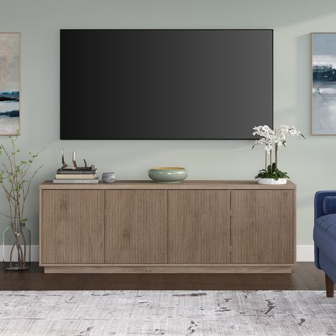 On-trend texture and design combine in this transitional TV stand. With a wood grain finish and textured doors, this piece is sure to be a statement in your living room, den, or game room. Gray Tv Stand Living Room, Transitional Tv Stand, Stand For Tv, Dallas Apartment, Oak Tv Stand, Tv Stand Decor, Living Room Console, Living Room Tv Stand, Seamless Transition