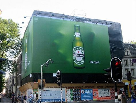 Brand: Heineken. Support Media: Wall takeover/Billboard. Effective because it adds a level of complexity beyond just the image of the beer. The ad creates the illusion of someone reaching for the beer from behind. There is an association of urgency created to grab one before they're all gone. Funny Billboards, Guerrilla Advertising, Funny Commercial Ads, Guerrilla Marketing, Heineken Beer, Clever Advertising, Beer Advertising, Billboard Advertising, Funny Commercials