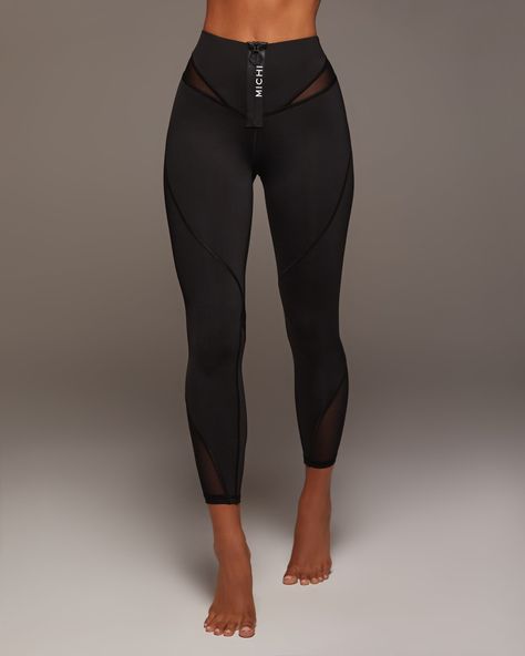 Designer's Notes A 4" High-Rise waistband legging, featuring a MICHI logo zipper at the front for an extra sporty look. Includes discretely placed mesh inserts for added ventilation and breathability. Features Sweat wicking Exceptional Breathability Eight-way stretch 4" Standard High-rise Waistband to smoothen the midsection Mesh insert at waistband and leg for added ventilation Made with Love in Canada Size & Fit High waisted Slim - Streamlined to hug the body Length: 7/8 Inseam: XXS 23", XS 24 High Rise Leggings Outfits, High End Athleisure, Sport Leggings Outfit, Workout Capsule Wardrobe, Gym Attire Women, Biker Leggings, Designer Leggings, Flare Legging, Athletic Clothing