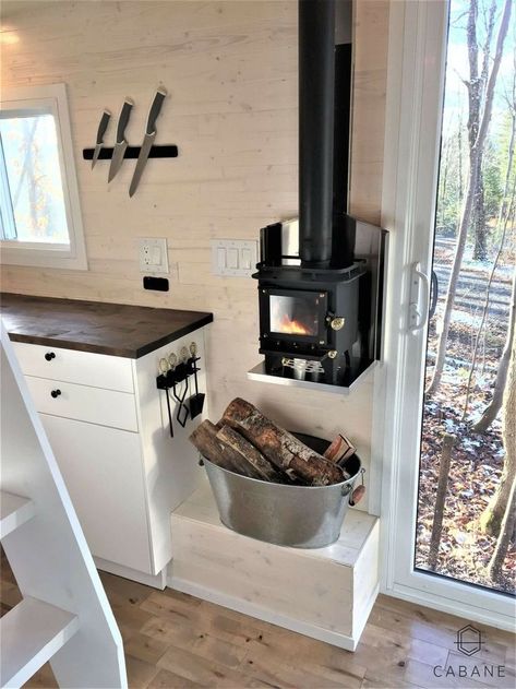 Placement and size of stove. Small Wood Burning Stove Tiny House, Wood Stove In Camper, Camper Wood Stove, Camper Living With Kids, Tiny Home Decorating Ideas, Homemade Wood Stove, Shed To Cabin Conversion, Tiny Cabin Kitchen, Small Cabin Kitchens