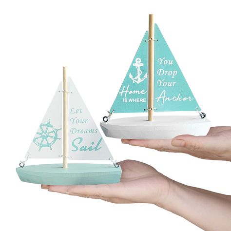 PRICES MAY VARY. ✨PREMIUM MATERIAL:Nautical decorations,hull are carved with high-density plates, with log-colored poles, green seawater and white waves, as the color of the sailboat symbolizes the purity of the seaside. Decorative ship handmade, not easy to break and deform, beautiful beach them decorations, make your home look warm and elegant. ✨UNIQUE DESIGN: Nautical bathroom decor measures 5.5x1.57x6.1inch, miniature sailboat with the words "let your dreams sail" and "home is where you drop Boat Ornaments, Sailing Theme, Florida Cottage, Sailboat Decor, Summer Beach House, Wooden Sailboat, Home Bedroom Office, Nautical Bathroom Decor, Model Sailboat