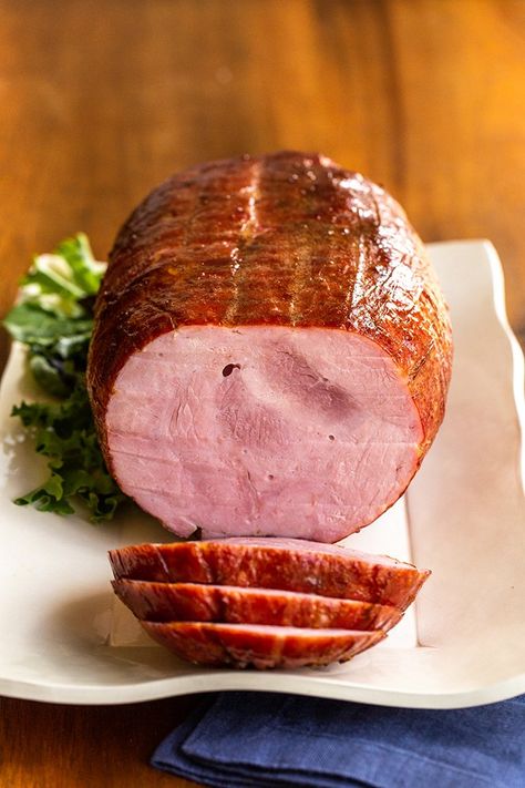 Learn how to cook a whole, boneless ham with the best glaze. It\'s an easy option for entertaining because they come pre-cooked. All you do is add flavor. #ham #holidayham #bonelessham How To Cook A Smoked Ham, Baked Boneless Ham Recipes Oven, Already Cooked Ham Recipes, How To Cook A Boneless Ham In The Oven, Best Way To Cook A Ham, Precooked Boneless Ham In Oven, How To Cook A Boneless Ham, Pre Cooked Ham In Oven, Boneless Precooked Ham Recipes