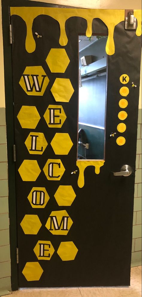 Honeycomb and honeybee decorated classroom door with welcome sign. Honey Bee Decor Diy Porch, Bee Library Bulletin Board, Bee Hive Classroom Door, Classroom Door Bee Theme, Bumble Bee Classroom Door, Bee Hive Door Decoration, Bee Themed Office, Library Bee Theme, Bee Themed Room Decor