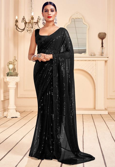 Faux Georgette Saree in Black This Drape is Highlighted with Sequins Work Available with an Unstitched Art Silk Blouse in Black Free Services: Fall and Edging (Pico) Do Note: All accessories shown in image is for presentation purpose only ( Slight variation in actual color vs. image is possible) Black Sequin Saree, Black Sari, Sequence Saree, Sequin Saree, Latest Indian Saree, 파티 드레스, Utsav Fashion, Black Saree, Casual Saree