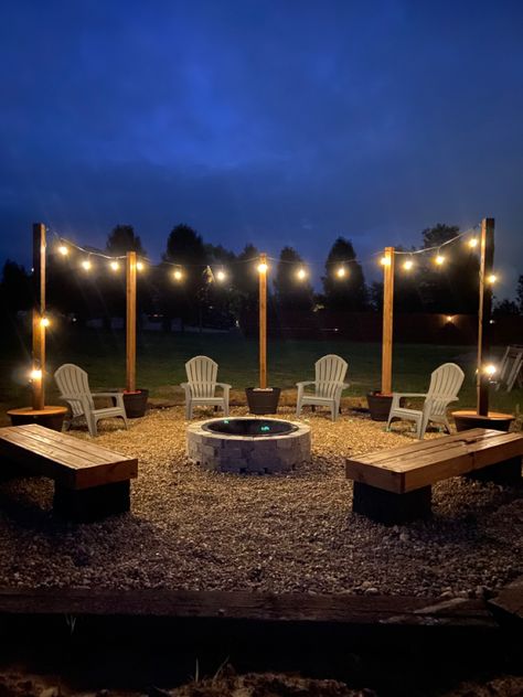 Stone Area In Backyard, Hanging Lights Around Fire Pit, Bon Fire Pit Ideas Backyards, Ideas For Fire Pit Area, Fire Pit Lights, Bonfire Pit Ideas Seating Areas, Fire Pit Planter, Back Yard Fire Pit Area, Railroad Ties Fire Pit