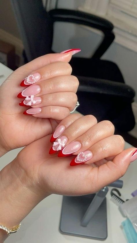 Nails Design With Red Color, Red Nail Charms, Pink Nails Design With Charms, Red Bow Nails French Tip, Red Acrylic Nails With Charms, Heart And Bow Nails, Red Pink Nails Design, Red And Pink French Tip, Pink Nails With Red Tips