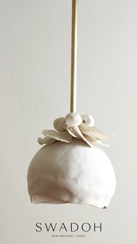 The Flora Pendant is a complete ode to nature that is hand sculpted in stoneware. Petals are a nest for delicate orbs atop the source of light. Glazed in white velvet, this fixture is available in three sizes. Custom options are available for fixture and hardware.
Light fixture from Jardin Collection by Crosland + Emmons. 6-8 week lead time, available through SWADOH. Handmade Pendant Light, Light Pendant, Ceramic Chandelier, Ceramic Lighting, Ceramic Light Fixture, Lighting Ideas, Pottery Lighting, Eclectic Lighting, Unique Pendant Lights