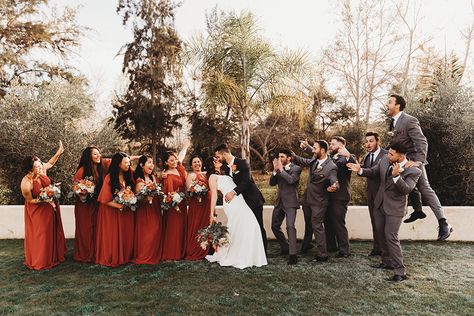 Grey And Rust Wedding Party, Rust Bridesmaid Dress With Groomsmen, Fall Wedding Grey Suits, Tan Groomsmen Suits With Terracotta, Terracotta And Grey Wedding Party, Dark Grey And Terracotta Wedding, Copper Bridesmaid Dresses With Groomsmen, Cinnamon Wedding Color Scheme Groomsmen, Groom And Groomsmen Attire Fall Wedding