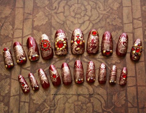 These India-inspired nails are simply stunning. The jewels and richly colored textiles of India in general and Rajasthan in particular have long been an inspiration for my work. The base is a rich burgundy with metallic gold detailing. The fabulous finishing touch is real Swarovski dome and facet crystals bordered with gold studs and gold bullion. High gloss finish. These are fantastic and I hope you will enjoy wearing them as much as I enjoyed making them! Sizes: Width (cm): 1.75, 1.65, 1.5,... Art Refence, Nails Indian, Insane Nails, Rajasthani Theme, Indian Nail Art, Nail Makeover, Indian Nails, Bridal Nail, Bridal Nail Art