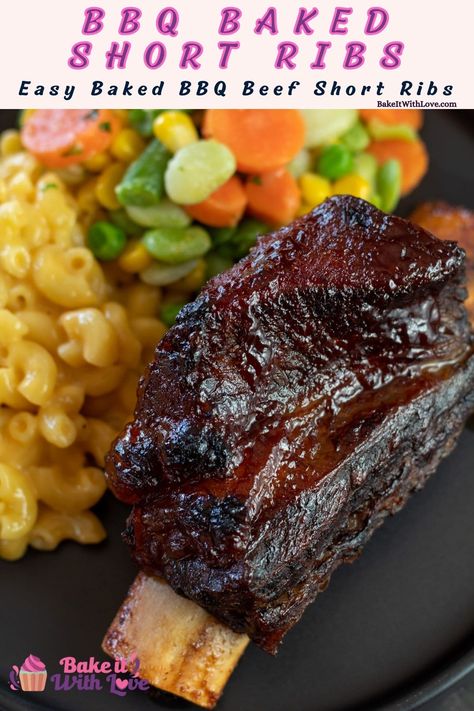 Slow cooked baked bbq beef short ribs served with mac n cheese and mixed veggies on black plate. Bake Beef Ribs In Oven, Bbq Braised Beef Short Ribs, Best Short Ribs Recipe Oven, Barbecued Beef Short Ribs, Bbq Beef Short Ribs Oven, Best Beef Short Rib Recipes, Bbq Short Ribs Oven, Short Ribs No Wine, Baked Short Ribs Recipe Ovens