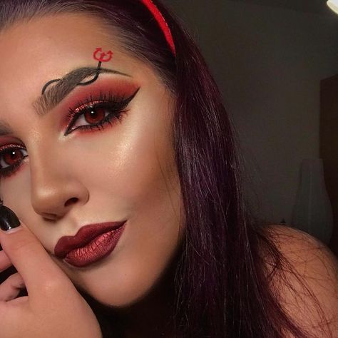 10 Easy Ways to Do Devil Makeup for Halloween 2018 | Byrdie UK Cute Devil Makeup Halloween Easy, Devil Costume Makeup Easy, Kids Devil Makeup, Simple Devil Makeup Halloween, Simple Devil Costume, Red Devil Makeup Halloween, Devil Makeup Halloween Easy, Cute Devil Makeup, Easy Devil Costume