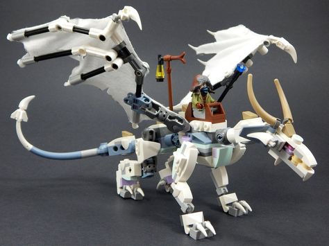 "Fyaska Hoarfrost Dragon" by Nuju Metru: Pimped from Flickr Lego Dinosaur, Lego Dragon, Lego Challenge, Lego Board, Lego Sculptures, Lego Animals, Lego Custom Minifigures, Lego Mechs, Amazing Lego Creations