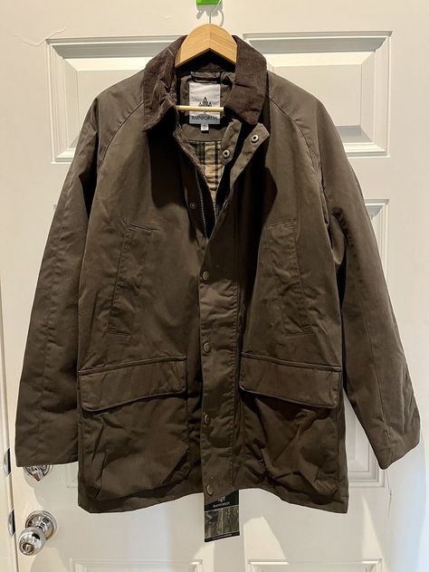 This Rainforest parka jacket is a must-have for any fashion-savvy man. With its Barbour-style design, it's perfect for both casual and formal occasions. Made with waxed cotton outer shell. It's brand new with tags and sized medium for a perfect fit. The brown color is versatile, making it great for any outfit. The quality on this coat is really nice. Please feel free to go on the Rainforest website, this jacket is the Explorer and the color is portobello. Pit to pit measures 21 inches. Sleeve measures 26 inches. Collar to bottom measures 32.5 inches. This elegant jacket seems to be designed for layering. Yellowstone Style, Flowy Fashion, Carhartt Detroit, Detroit Jacket, Barbour Style, Waxed Cotton Jacket, Elegant Jacket, The Rainforest, Parka Jacket