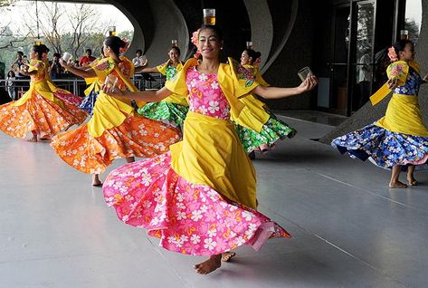 Filipino dancers perform the Binasuan, a dance using glasses with liquid, during the Pasinaya Festival in Manila on February 3, 2013. The Cultural Center of the Philippines held one day multi-arts festival as thousands of artists from dance, music, theater, visual arts, literature and cinema took part in the festivities. -Photo by AFP Binasuan Folk Dance, Filipino Folk Dance, Philippine Folk Dance, Filipino Dance, Cultural Center Of The Philippines, Philippine Festivals, Multicultural Festival, Candle Dance, Philippine Culture