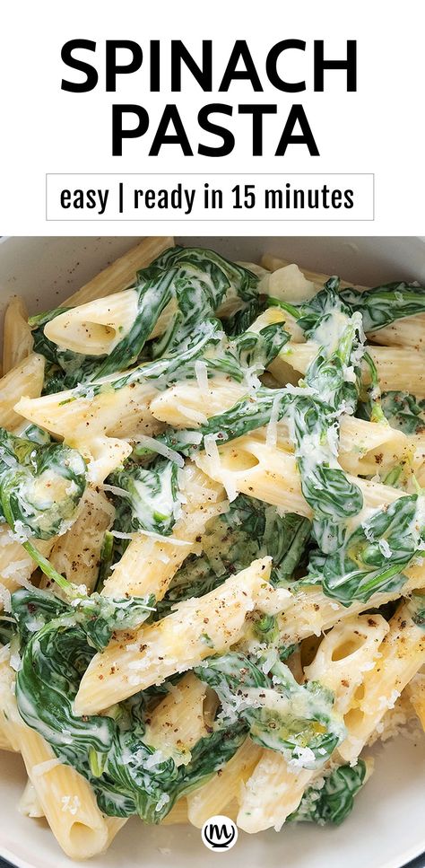 Top view of a bowl full of spinach pasta with grated  parmesan. Easy Spinach Dinner Recipes, 15 Minute Spinach Pasta, Parmesan Spinach Pasta, Bow Tie Spinach Pasta Recipes, Quick Spinach Pasta, Chicken Spinach Pasta Recipes Easy, Easy Pasta With Spinach, Creamed Spinach Pasta Recipe, Spinach Pasta Side Dish