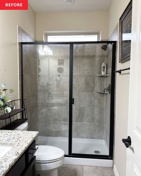 Black framed glass shower door in bathroom before renovation. Black Shower Glass Door, Bathroom With Black Shower Door, Framed Glass Shower Doors, Paint Grasscloth Wallpaper, Sliding Shower Door Makeover, Glass Door Shower Ideas, Bathroom With Glass Shower Door, Black Frame Shower Door, Black Shower Frame