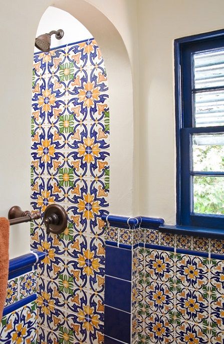 Hand-painted Spanish wall tile are used for the show and bathroom wall Talavera Tile Bathroom, Blue Spanish Bathroom, Mexican Bathroom Tile, Mexican Bathroom Ideas Spanish Style, Italian Tile Bathroom, Latin Bathroom, Spanish Bathroom Tile, Spanish Tiles Bathroom, Talavera Tiles Bathroom