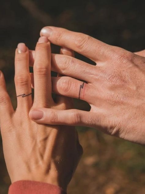 Ditch the Rings: 21+ Badass Wedding Ring Tattoos That Say “Forever" Men’s Tattoo On Ring Finger, Thumb Ring Tattoos Women, Tattooed Wedding Bands, Tattooed Wedding Rings, Ring Finger Tattoo Men, Wedding Ring Tattoo Ideas For Women, Ring Tattoo For Men, Marriage Tattoos Ring Finger, Celtic Ring Tattoo