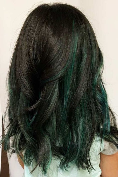 Teal & Black #peekaboohair #blackhair ❤️ Peekaboo hair is a little hint of wild color that can add a lot of character and individuality to your look! Dream about coloring your hair brightly? Dive in our gallery to see how to do it in a modern way: purple streaks for blonde hair, hidden rainbow and galaxy colors under a brown base, dark teal and mermaid ideas, burgundy highlights for black hair, and ideas for all tastes are here! ❤️ #lovehairstyles #hair #hairstyles #haircuts What Color Looks Good With Brown Hair, Green Peakaboo Hair, Wild Color Hair Ideas, Dark Green Ends Hair, Dark Hair Green Highlights, Forest Green Peekaboo Hair, Dark Brown And Dark Green Hair, Emerald Green And Brown Hair, Emerald Peekaboo Hair