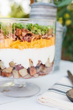 The TomKat Studio | Blog: Delicious Layered Baked Potato Salad... Trifle Bowl Recipes Layer Salad, Savory Trifle Recipes, Savory Trifle, Lakehouse Food, Layered Salads, Trifle Bowl Recipes, Trifle Recipes, Baked Potato Salad, Picnic Recipes