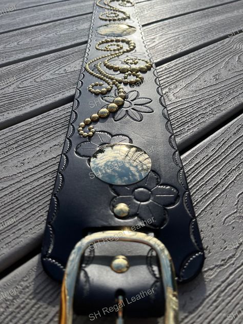 This beautiful regalia belt is made from 7/8oz. vegetable tanned leather and measures 36" long x 4" wide. There is a intricate vine pattern made up from brass spots ranging in size from 3/16"- 1/2"in size. There is a 3" polished brass center concho as well as 2ea. 2" polished brass concho's on each of the ends. Every piece of this regalia belt has a tooled border as well as two styles of flowers randomly tooled down the length of the belt. Finally, it has been finished off with a polished brass Vine Pattern, Suspender Belt, Clear Coat, Vegetable Tanned Leather, Polished Brass, Suspenders, Pattern Making, Tan Leather, Belts