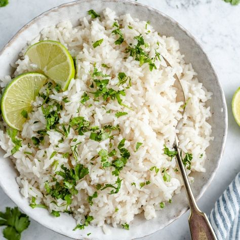 My absolute favorite, creamy coconut rice made with four simple ingredients for the best side dish! This easy coconut rice recipe is ready in just under 30 minutes and is delicious paired with your favorite meals like salmon, stir frys, curries and more. #rice #coconutrice #sidedish #vegan #vegetarian #howtoguide Instant Pot Cilantro Lime Rice, Coconut Rice Recipe, Lunch Restaurant, Rice Food, Ambitious Kitchen, Lime Rice, Cilantro Lime Rice, Homemade Tomato Sauce, Coconut Rice