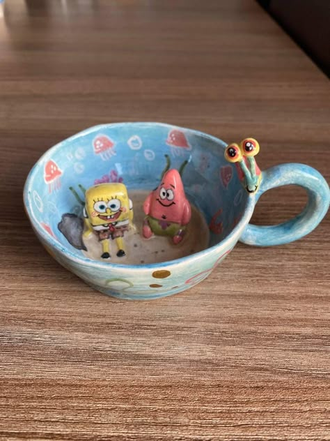 cartoon characters ceramic mug Only 1 piece was produced. Big Funny Mugs, Coffee Mug Crafts Ceramic, Creative Clay Mug, Mom Clay Mug, Kid Coffee Mugs, Cool Mugs Ceramic, Polymer Clay Astronaut Mug, Planet Clay Mug, Ceramic Mugs Handmade Animal