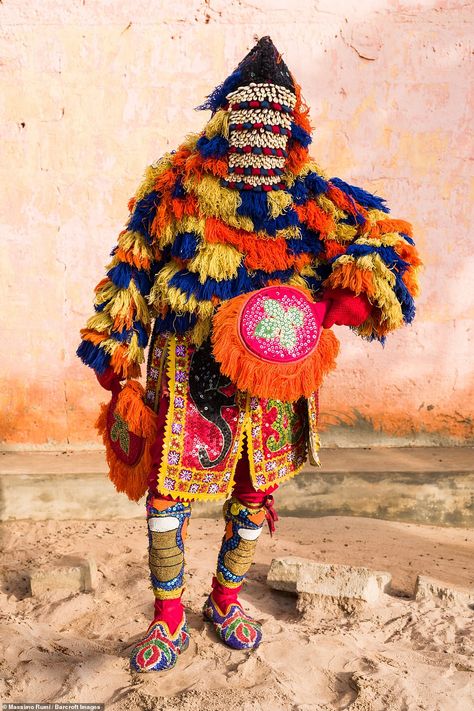 Voodoo 'living ghosts' dance through streets as Egungun of Benin give advice to the living | Daily Mail Online African Masquerade, West African Masquerade, Nigerian Masquerades, Egungun Masquerade, African Voodoo, Ancient Yoruba People, Egungun Yoruba, Ghost Light, Egyptian Jewelry