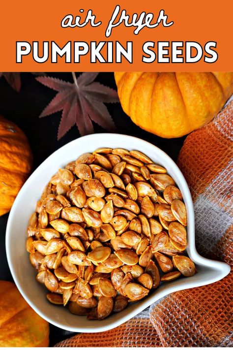 A white bowl with roasted pumpkin seeds and Fall decor around. Pumpkin Seed Recipes Salted, Air Fryer Pumpkin Seeds, Air Fryer Pumpkin, Pumpkins For Halloween, Pumpkin Seed Recipes, Carving Pumpkins, Fall Snacks, Crunchy Snack, Delicious Pumpkin