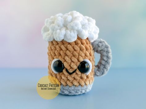 🍀 Mini Hoppy Hour Amigurumi Beer Mug Crochet Plush Pattern 🍺 Get ready to downsize your St. Patrick's Day celebration with this adorable miniature beer mug pattern! Key Features: - Skill Level: Intermediate - Finished Dimensions: A cute and compact 4.5 inches - Materials Needed: Super bulky plush yarn in White, Yellow, and Gray - Special Techniques: Crafted using the same continuous rounds method for seamless construction Benefits: Due to its smaller size, this pattern works up even faster, offering you a pint-sized St. Patrick's Day plush. Step-by-Step Instructions: Just like its bigger counterpart, this pattern comes with detailed written instructions and helpful photos. Versatility and Customization: Experiment with green yarn to give your mini beer mug a festive St. Patrick's Day twi Amigurumi Beer Mug Free Pattern, Crochet Beer Mug, Crochet Beer Cozy, Mug Crochet, Plush Crochet Pattern, Crochet Beer, Mug Pattern, Crochet Mug Cozy, Crochet Dress Pattern Free