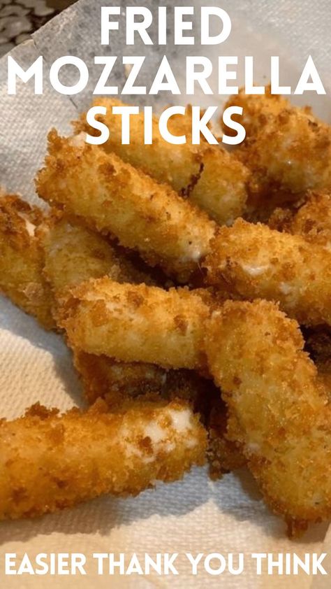 In a medium bowl, combine bread crumbs, 1 cup Parmesan cheese, and salt. Cut each mozzarella stick in half. Beat the eggs in a shallow bowl and dip the cheese sticks into the eggs to coat completely and allow the excess egg to drip into the bowl. Coat the cheese in the breadcrumb mixture, tapping to adhere and coat completely. Repeat dipping the cheese sticks in the egg and breadcrumb mixture to coat a second time. Place cheese sticks on a baking sheet, cover, Homemade Fried Mozzarella, Green Beans Air Fryer, Beans Air Fryer, Fried Mozzarella Sticks, Fried Cheese Sticks, Homemade Mozzarella Sticks, Fried Mozzarella, Mozzarella Sticks Recipe, Avocado Egg Rolls