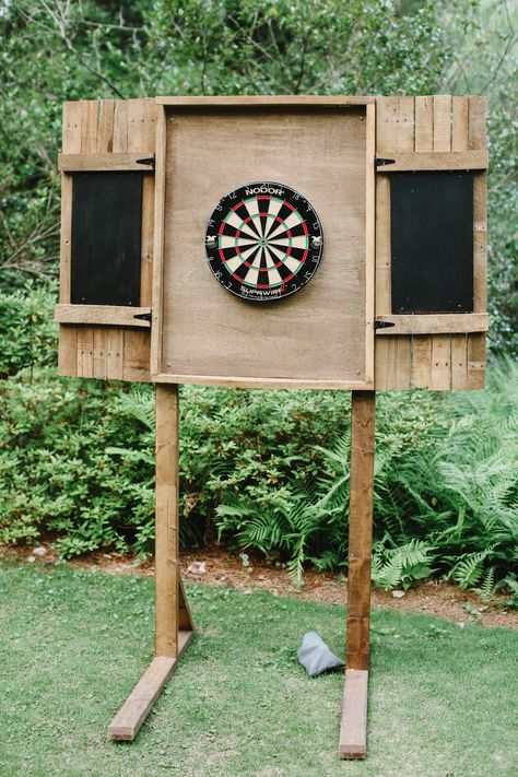 Dart Board Backboard Outdoor, Dart Board Wedding, Diy Wood Projects Outdoor Yard Games, Small Patio Wall Decor, Outdoor Dart Board Cabinet, Backyard Yard Game Area, Wood Outdoor Games, Large Backyard Lighting Ideas, Dart Board Outside