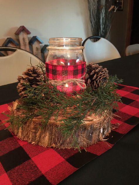 Lumberjack baby shower centerpieces. Cedar slice, cedar greens (no sap leakage), pine cones, and a mason jar with a tea light Buffalo Check Centerpieces, Buffalo Plaid Fireplace Decor, Lumberjack Party Centerpiece, Christmas Plaid Party Theme, Plaid Centerpiece Ideas, Lumberjack First Birthday Centerpieces, Buffalo Plaid Centerpiece Ideas, Cabin Centerpiece Ideas, Buffalo Plaid Party Ideas