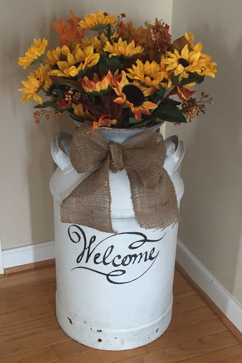 Milk can love... Change bow & flowers for each season and holiday Decorating Old Milk Cans, Milk Jugs Decor, Decorating Milk Cans For Christmas, Milk Cans Ideas Front Porches, Fall Milk Can Decor, Milk Can Winter Decor, Small Milk Can Ideas, Milk Can With Flowers, How To Decorate An Old Milk Can