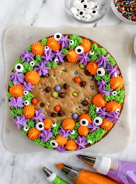 Halloween Loaf Cake Decoration, Giant Halloween Cookie, Spider Web Cookie Cake, Purple Cookie Cake, Cookie Cake Decorating Ideas Halloween, Halloween Cookie Cake Decorating, Halloween Themed Cakes Easy, Ghost Cookie Cake, Cookie Cakes Birthday Designs