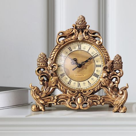 This vintage desk clock features silent operation and high-quality resin. Hand-made with exquisite carvings and bronze gold, it is low-key and luxurious, suitable for offices, study rooms, living rooms, etc.Note: This product requires one AA battery, which is not included. Vintage Gold Decor, Jordan Baker, Carved Table, Harry Potter Illustrations, Gold Clock, Retro Clock, Antique Clock, Tabletop Clocks, Study Rooms