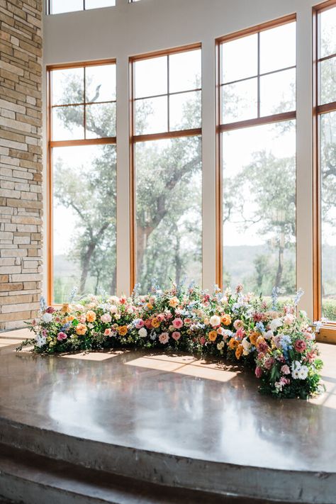 Grounded Crescent Floral Ceremony Arch; ground flower meadow wedding flowers; From the outset, they envisioned a celebration that embraced the natural beauty of a garden wedding flowers setting, with blooms that echoed the colors of a bright summer day. Flower Meadow Wedding Ceremony, Ground Meadow Wedding Ceremony, Flower Arch On Ground Wedding, Ground Arch Floral, Floral Arch On The Ground, Ground Altar Flowers, Ground Ceremony Florals, Half Circle Ceremony Flowers, Floor Floral Arch