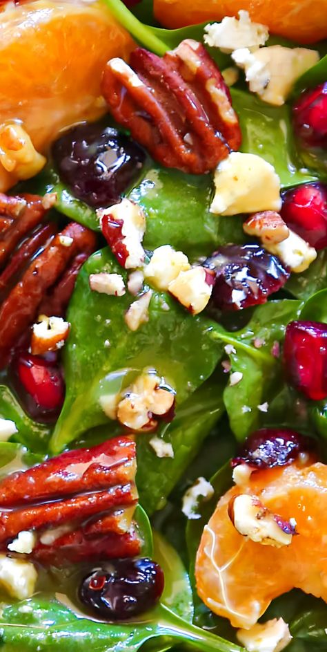 This simple 20-Minute Christmas Salad features classic holiday ingredients, such as pecans, mandarin oranges, pomegranate seeds, and dried cranberries. They are tossed with baby spinach, goat cheese, and homemade Honey-Mustard Lime Vinaigrette. This festive holiday salad will pair beautifully with your favorite Christmas main course and will be a great addition to your holiday menu. Honey Mustard Lime Vinaigrette, Christmas Spinach Salad, Christmas Salads Australia, Xmas Pasta Salad, Holiday Honey Crisp Salad, Holiday Green Salad Recipes, Christmas Side Salads, Winter Salad With Pomegranate, Mandarine Salad