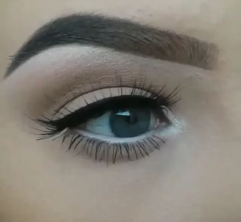 white shadow on upper brow blended into brown faded into light brown or cream, thick black eyeliner wing, light mascara on upper and lower lashes, and white eyeliner on bottom water line with white eyeshadow in inner corner. White Eyeshadow Under Eye, Eye Shadow In The Inner Corner, White Eyeliner Lower Lash Line, White Inner Eyeliner, White Corner Eye Makeup, White Eyeliner Inner Corner, White Inner Eye Makeup, Black Water Line Eyeliner, White Eyeliner Pencil Looks