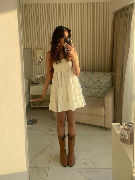 Dress With Short Cowgirl Boots, Nashville Birthday Dress, Non Country Cowboy Boot Outfit, Straw Hat And Dress Outfit, Sundress Cowgirl Boots, White Flare Jeans Outfit Western, White Flowy Dress With Cowgirl Boots, Cute Stagecoach Outfits, Sundress Cowboy Boots Summer Outfits