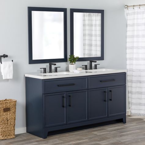 Transform your bathroom with the Potter 60.5-in W deep blue vanity. This double-sink bathroom vanity features a Shaker-style design that’s complemented by a 1-piece white cultured marble sink top and matte black hardware. Pre-assembled and ready to install, this vanity also includes a wraparound drawer with 3 compartments and a 2-door cabinet below each sink for easy-access storage space. This transitional vanity adds style and storage in large and shared bathrooms. Style Selections Potter 60-in Blue Double Sink Bathroom Vanity with White Cultured Marble Top | LW24W60P2-DB Navy Vanity White Tile Bathroom, Bathroom Cabinet Navy, Blue Double Sink Bathroom Vanity, Blue Bathroom Vanity With Black Hardware, Navy Vanity With Black Hardware, 49 Inch Bathroom Vanity, Navy Blue And Grey Bathroom Ideas, Navy Blue Cabinets With Black Hardware, Blue Cabinet Bathroom Ideas