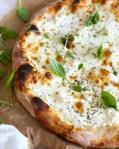 Garlicky White Pizza with Mozzarella and Ricotta If you’re a pizza lover and enjoy experimenting with new flavors, this Garlicky White Pizza with Mozzarella and Ricotta is a must-try. It’s ... Read more White Pizza With Zucchini, Ricotta Pizza Ideas, Zucchini Ricotta Pizza, Homemade Pizza With Fresh Mozzarella, Chicken Ricotta Pizza, Pesto Ricotta Pizza, Bianco Pizza Recipe, White Pizza With Ricotta Cheese, Ricotta Pizza Sauce