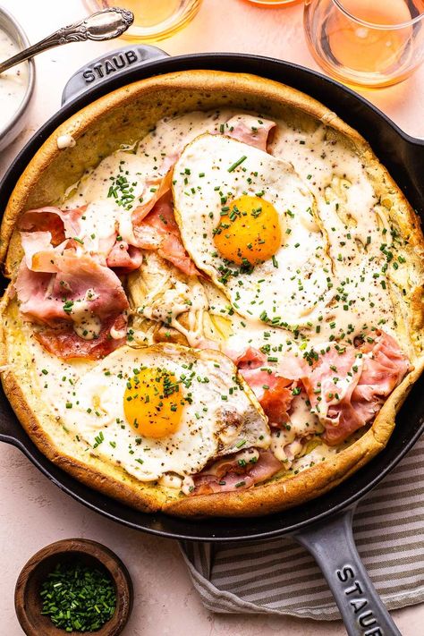 Our easy Ham and Cheese Dutch baby is a fluffy, oven-baked pancake that's loaded with salty ham, gruyere, eggs, and bechamel sauce. Goat Cheese And Dill Dutch Baby, Breakfast Dutch Baby, Dutch Baby Recipes, Dutch Baby Savory, Savoury Dutch Baby, Bake Breakfast Ideas, Breakfast In Bed Recipes, Dutch Babies Recipe, Weekday Breakfast Ideas