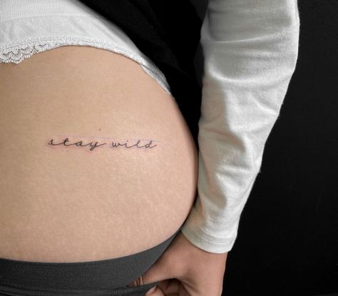 tatoo meaning . Stay Wild Hip Tattoo, Wild Word Tattoo, Stay Wild Buttcheek Tattoo, Stay Wild Tattoos For Women, Stay Wild Tattoo Buttcheek, Stay Wild Tattoo Fonts, Lower Back Word Tattoos, But Cheek Tattoo, Bite Me Tattoo Buttcheek