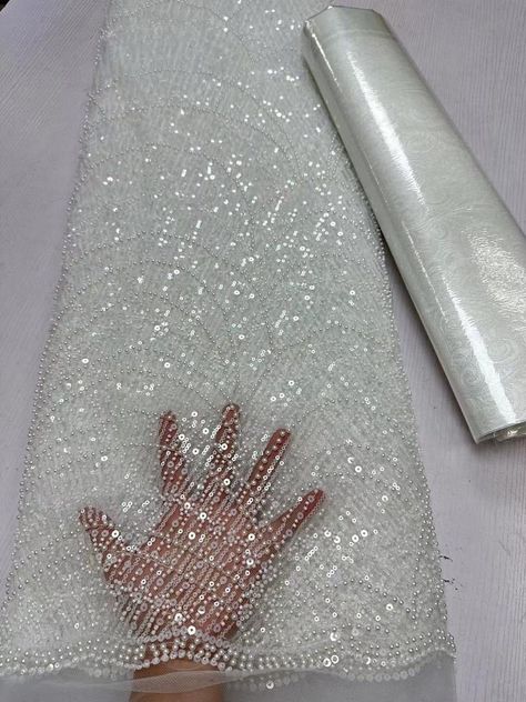 This high quality Fabric is measured in 5 Yards With Embroidered Beading and Sequin. It is soft, very delicate and beautiful. This high Quality Fabric is made with Fashion embroidered rhinestones can be used in making party wedding dresses, skirts, shawls, scarves and other other fashion apparels as you would like. Size : Length : 5 yards (180 inch). Width: 50 inch (Please allow slight deviation for the measurement data ,±1 inch) Material: 100% Polyester, Tulle Lace Fabric, Eco-Friendly embroide Peplum Fabric, Finger Mehendi Designs, Hand Beaded Lace, Rhinestone Fabric, Beaded Lace Fabric, Embroidered Lace Fabric, Luxury Fabric, Net Fabric, Fabric Beads